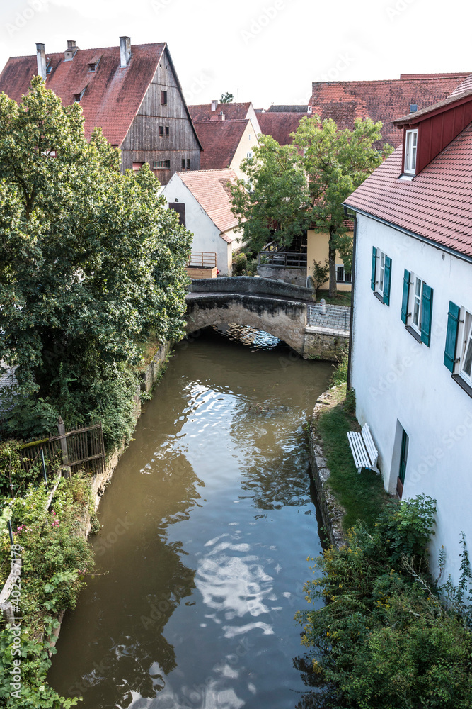 Lonely little bridge across the river at the medieval old town