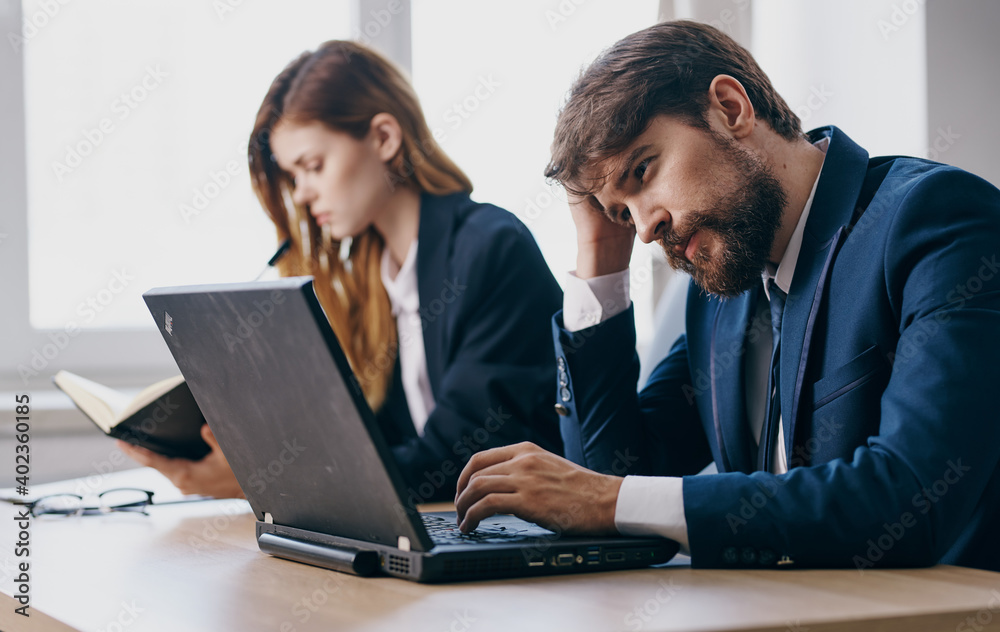 Business man and woman working desk technology internet communication finance office Business man and woman working desk technology internet communication finance office