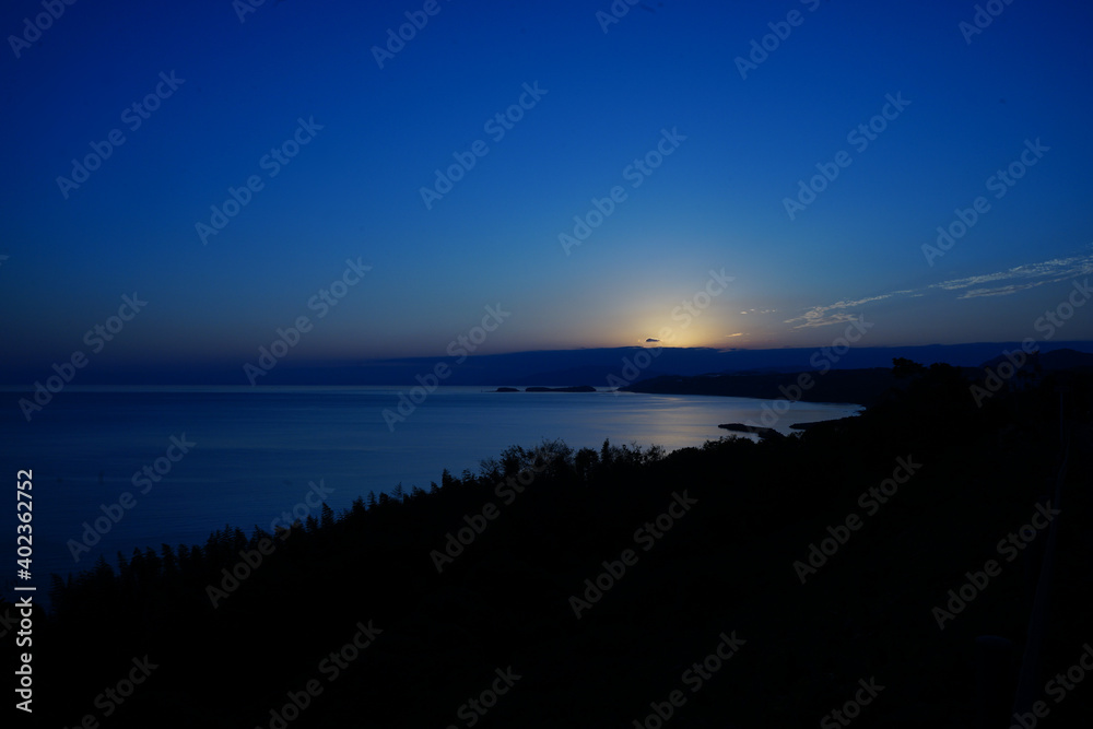Fototapeta premium Aerial view of Nagasaki bay at dusk in Nagasaki, Japan - 日本 長崎湾の夕日