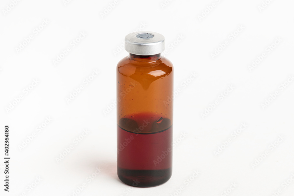 Fototapeta premium Macro Image Of Amber Vaccine Vial In White Background