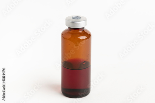 Macro Image Of Amber Vaccine Vial In White Background