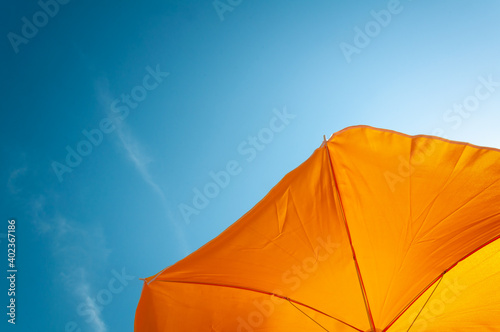 yellow parasol and blue sky