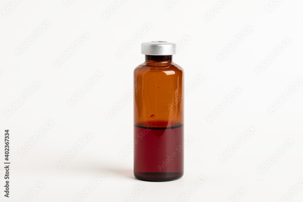 Macro Image Of Amber Vaccine Vial In White Background Macro Image Of Amber Vaccine Vial In White Background