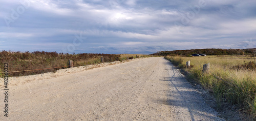 Dirt road by the long strip of Duxbury beach