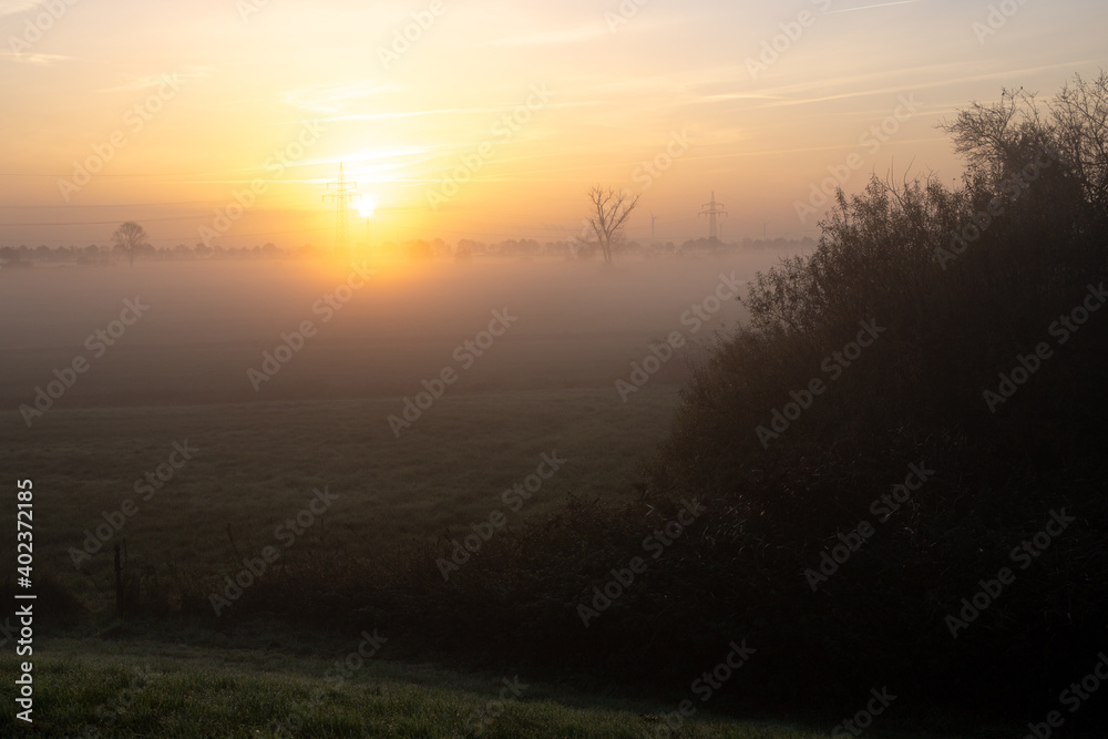 misty morning in an agricultural landscape with wind turbines, rural, idyllic, renewable energy misty morning in an agricultural landscape with wind turbines, rural, idyllic, renewable energy