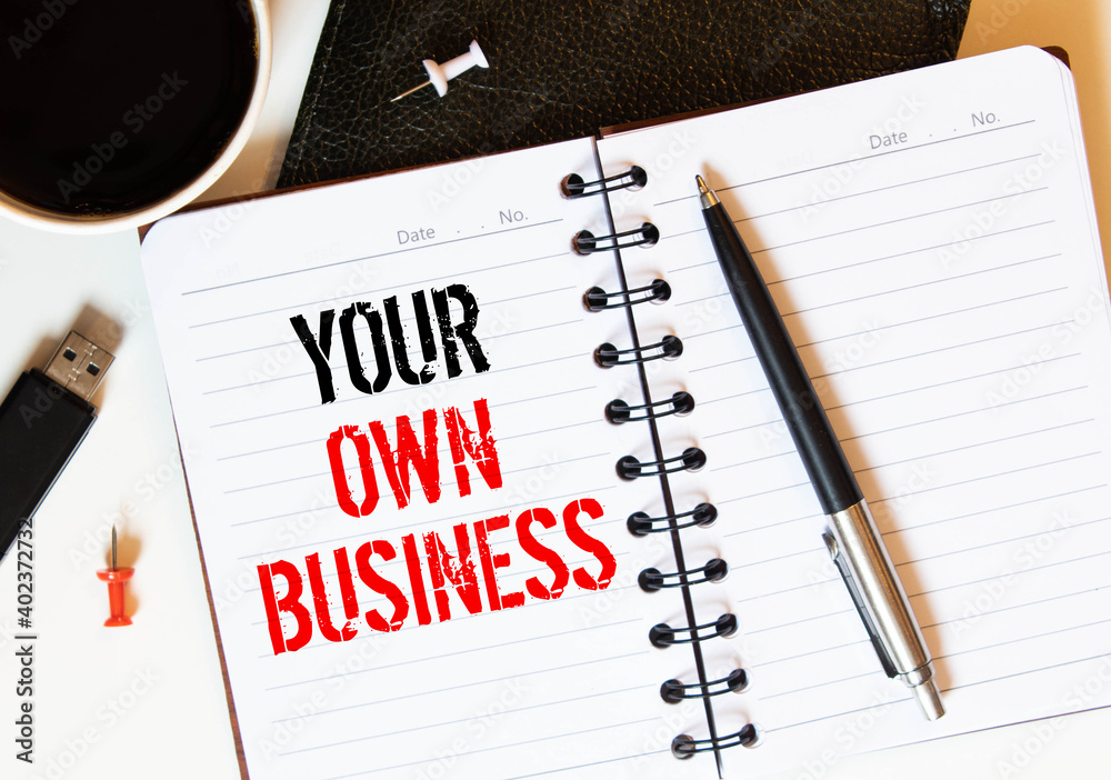 Your Own Business note paper pinned on cork board Your Own Business note paper pinned on cork board