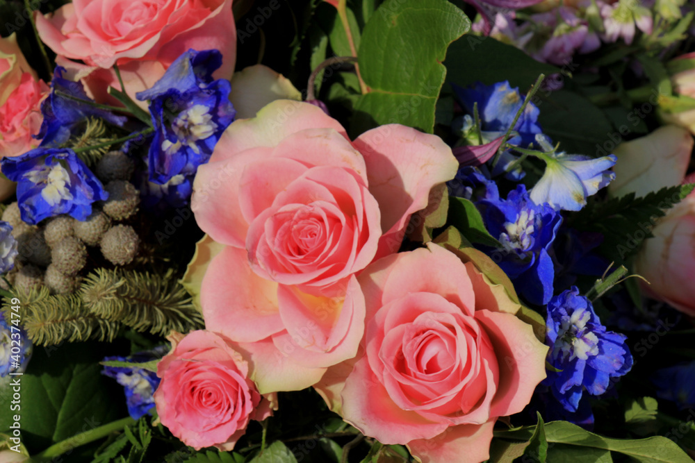 Pink roses and blue larkspur Pink roses and blue larkspur