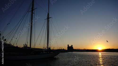 sailing boat during sunset in the harbor