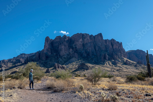 Desert mountains landscape with hiker