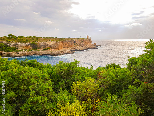 Panorama view on bay and Torre den Beu Cala Figuera. photo