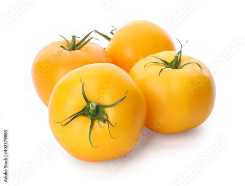 Delicious ripe yellow tomatoes isolated on white