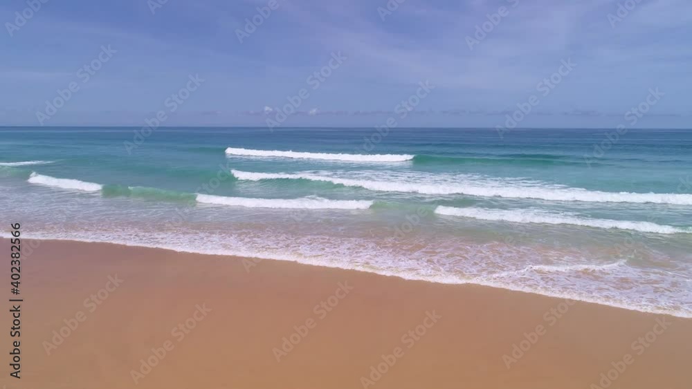 Drone camera flying over sea sandy waves break on beach,Aerial view Concept Nature and Business travel,beach deserted and New normal after covid-19 Phuket beach is famous tourist destination at Phuket Drone camera flying over sea sandy waves break on beach,Aerial view Concept Nature and Business travel,beach deserted and New normal after covid-19 Phuket beach is famous tourist destination at Phuket
