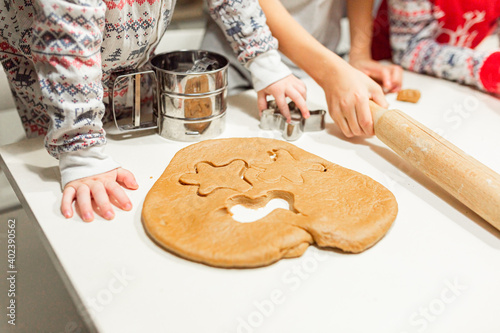 happy family funny kids are preparing the dough, bake cookies in the kitchen