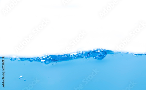 Water droplets and blue waves on a white background