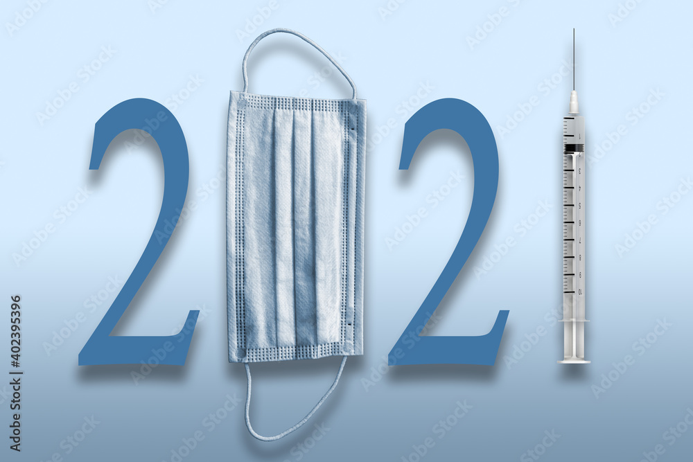 Obraz premium Year 2021 with Medical Face mask and COVID Vaccine in a Syringe