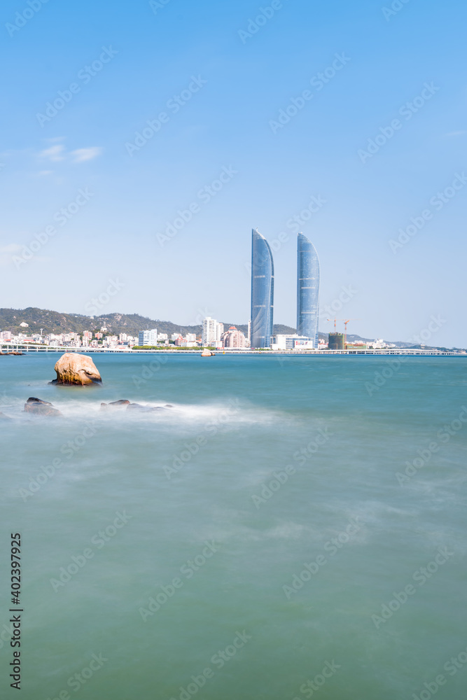 Seaside scenery of Shimao twin towers in Xiamen, Fujian, China Seaside scenery of Shimao twin towers in Xiamen, Fujian, China