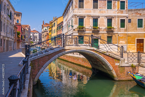 A small and beautiful bridge on the streets of Venice town in Italy © Aliaksandr