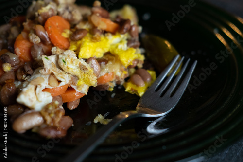 Pinto Bean and Pork with egg on a plate