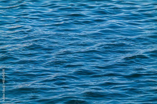 the surface of rough wave and blue sea water.