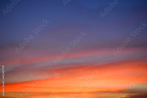 Beautiful view of sunset and orange sky at twilight time above the clouds with dramatic light.