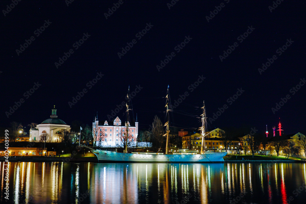 Stockholm, Sweden The city lights and skyline on a dark December night and the island of Skeppsholmen.