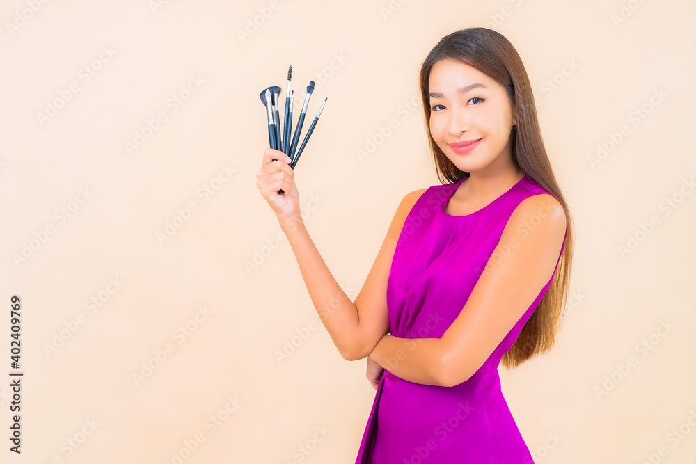 Portrait beautiful young asian woman with make up brush Portrait beautiful young asian woman with make up brush
