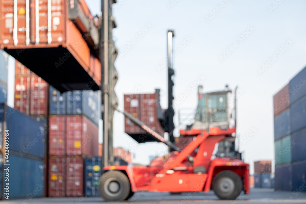 Blurred image of crane truck level up cargo container tank and move to other area in workplace. Concept of background image for incorporate to news of other media. Blurred image of crane truck level up cargo container tank and move to other area in workplace. Concept of background image for incorporate to news of other media.