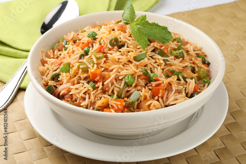Картината върху платно Veg Schezwan Fried Rice Vegetarian Szechuan Rice is indo-chinese cuisine dish with bell peppers, green beans, carrot
