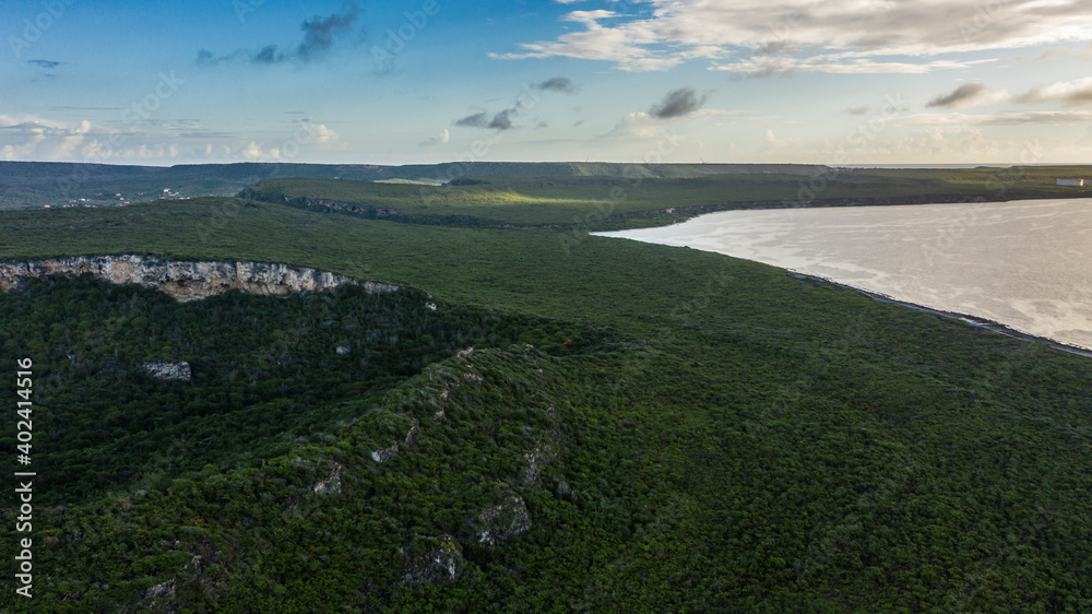 Aerial view above scenery of Curacao, Caribbean with ocean, coast, hills