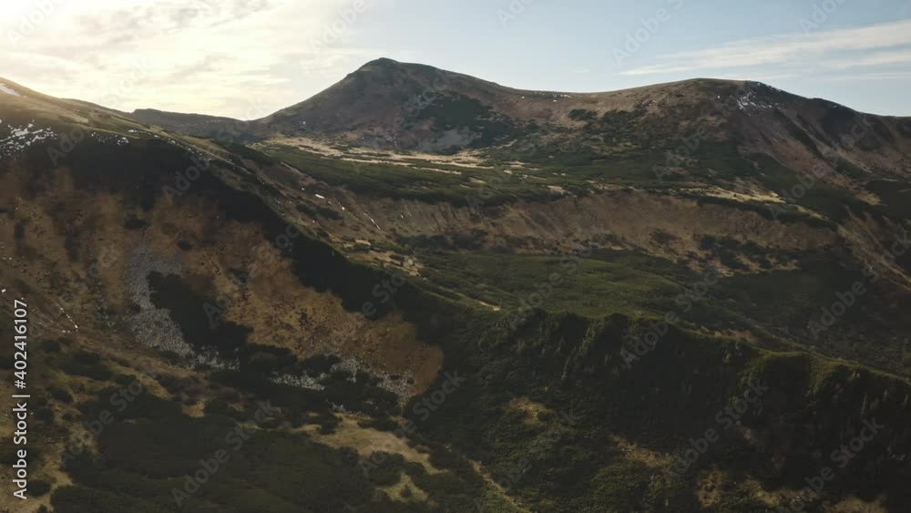 Close up mountain rock top aerial. Green grass, moss at hills, peak ...