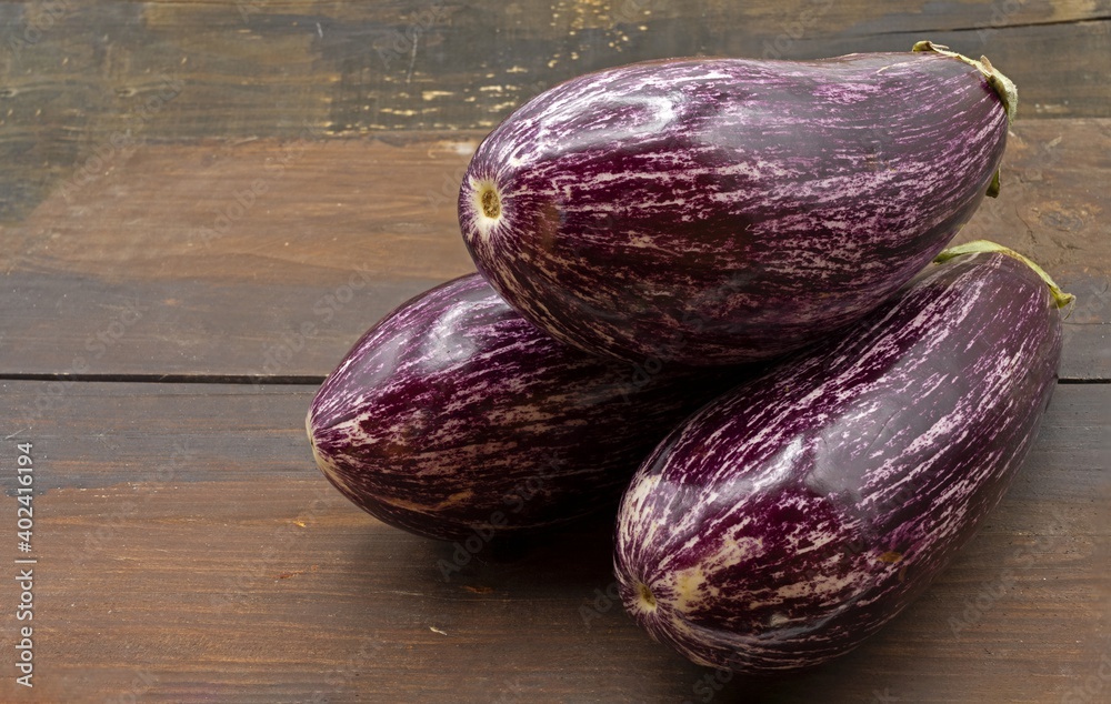 photo with natural light of fresh purple eggplants photo with natural light of fresh purple eggplants