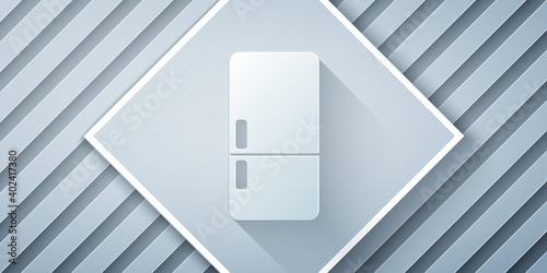 Paper cut Refrigerator icon isolated on grey background. Fridge freezer refrigerator. Household tech and appliances. Paper art style. Vector.