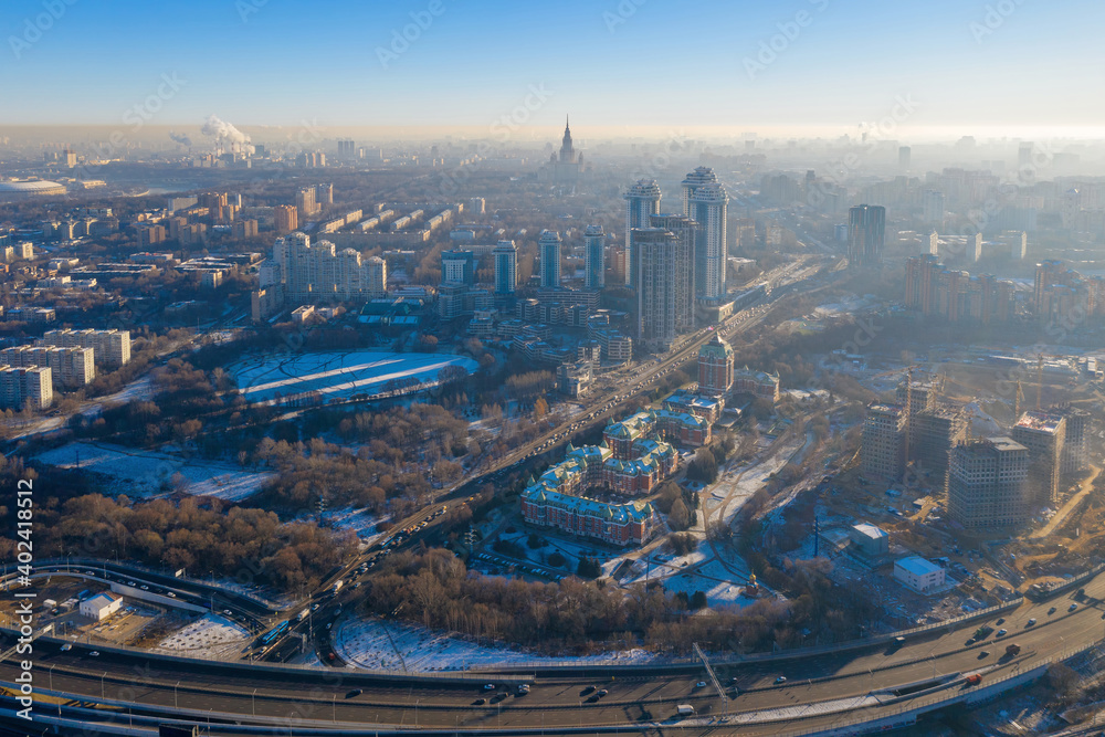 Contre-jour aerial view of Moscow (Ramenki district) at sunny winter day. Russia. Contre-jour aerial view of Moscow (Ramenki district) at sunny winter day. Russia.
