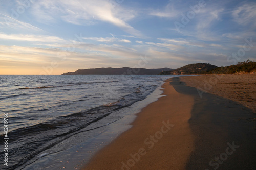 sunset on the sandy beach of Thyrrenian sea in Tuscany region
