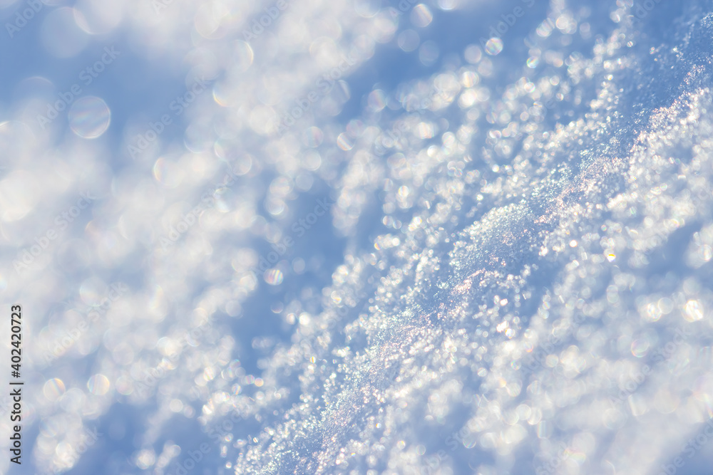 Snow close-up. Winter background with snow texture and beautiful bokeh. Shallow depth of field and blur. Perfect for Christmas and New Year design. View with copy space. Snow close-up. Winter background with snow texture and beautiful bokeh. Shallow depth of field and blur. Perfect for Christmas and New Year design. View with copy space.