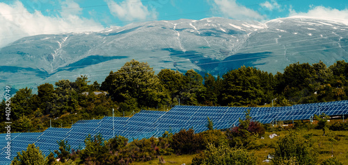 Solar panels in a large countryside in the mountains of the Abruzzo region, Italy © cenz07