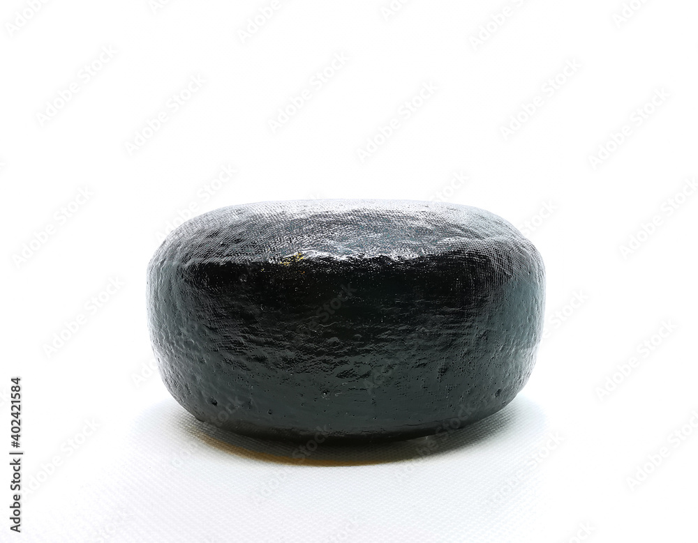 Fototapeta premium Wax-coated cheese wheel picture taken in a lightbox