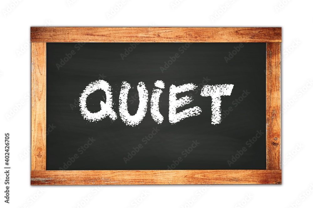 QUIET text written on wooden frame school blackboard. QUIET text written on wooden frame school blackboard.