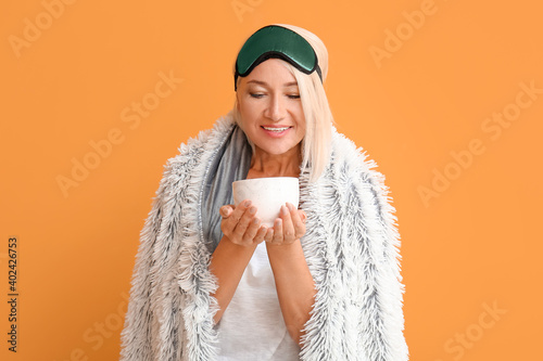 Mature woman in sleep mask ...