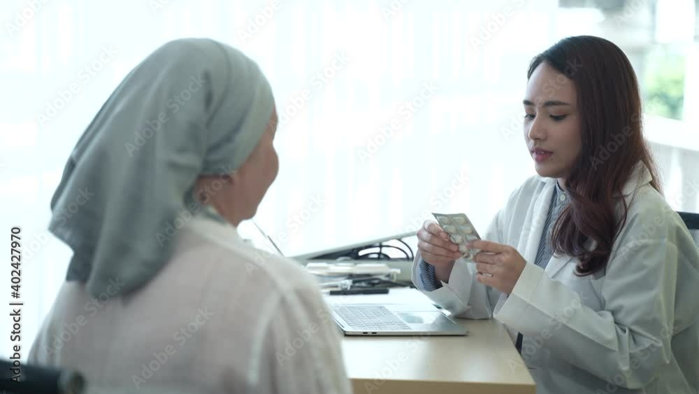 a professional doctor examines health and gives medicine drug to the patient, senior cancer patient woman visit doctor in hospital a professional doctor examines health and gives medicine drug to the patient, senior cancer patient woman visit doctor in hospital