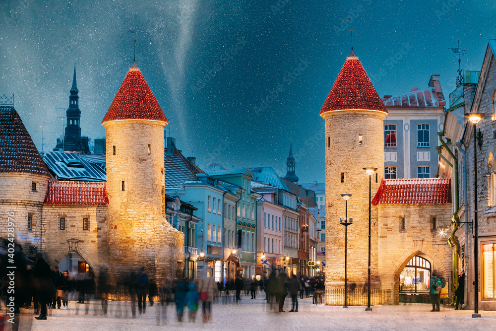 Tallinn, Estonia. Night Starry Sky Above Famous Landmark Viru Gate Gates. Street Lighting In Winter Holiday Evening. Christmas Xmas, New Year Vacation In Old Town. UNESCO Heritage. Altered Sky - obrazy, fototapety, plakaty 