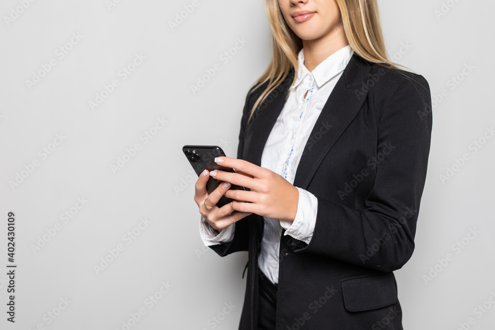 Young businesswoman look at cellphone isolated on white background. Close up Young businesswoman look at cellphone isolated on white background. Close up