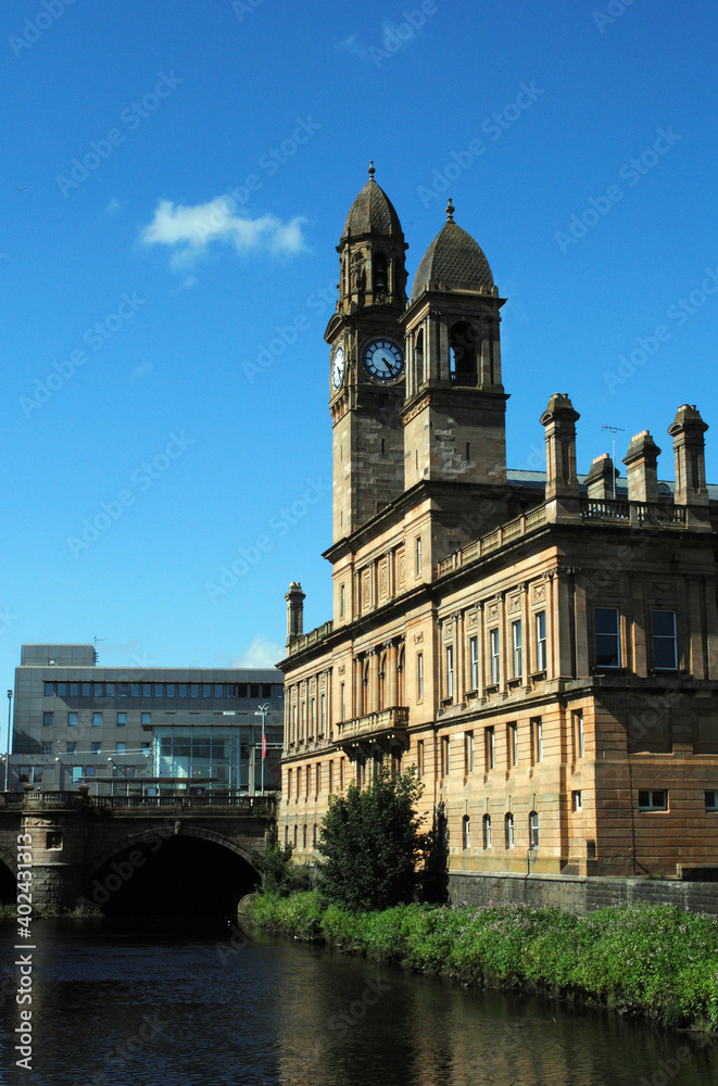 Public Building with Clock Tower Beside River on Sunny Day 