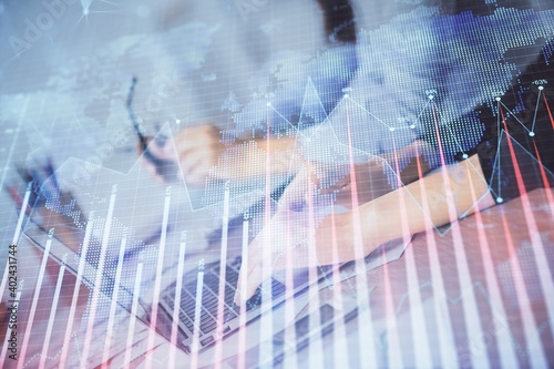 Multi exposure of woman hands typing on computer and financial chart hologram drawing. Stock market analysis concept.