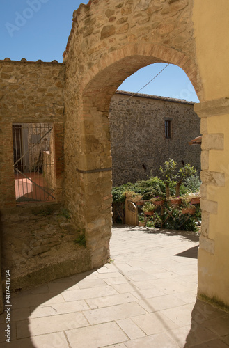 A stone archway in the historic medieval village of Scansano, Grosseto Province, Tuscany, Italy
 photo