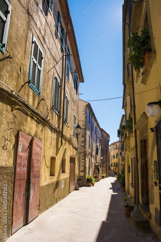 Fototapeta premium A quiet residential street in the historic medieval village of Scansano, Grosseto Province, Tuscany, Italy 