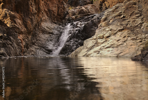 Gran Canaria, landscapes along the hiking route around the ravive Barranco del Toro at the southern part of the 
island, full of caves and grottoes, close to San Agustin resort, water is running in th photo