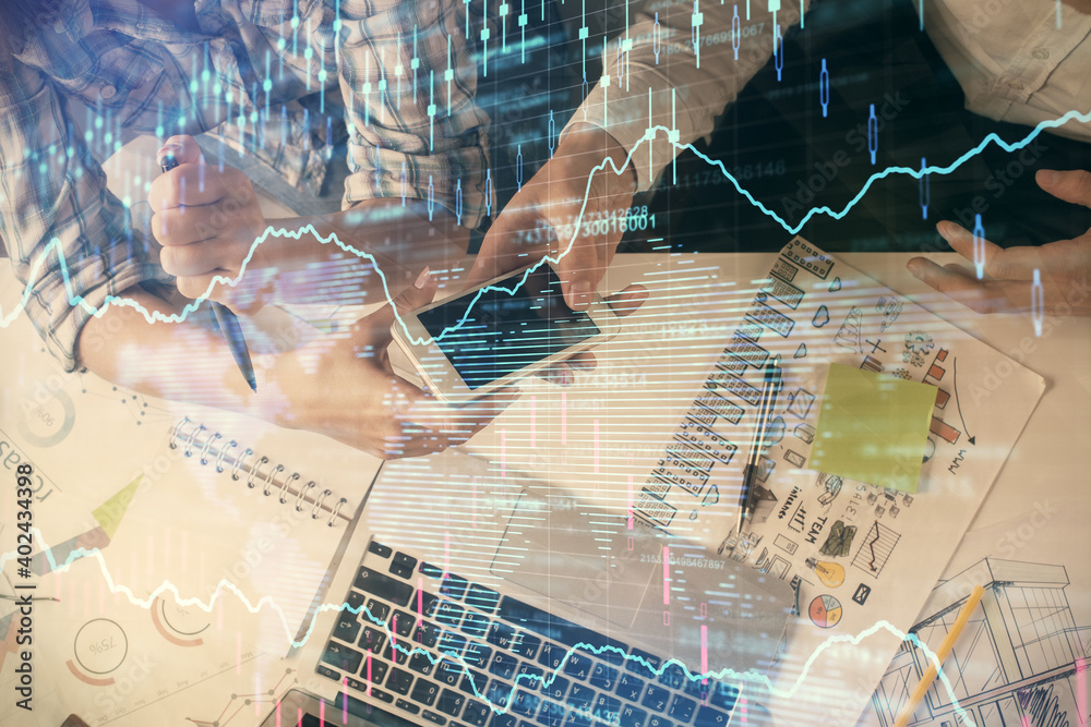 Double exposure of forex graph drawing and man and woman working together holding and using a mobile device. Trade concept. Double exposure of forex graph drawing and man and woman working together holding and using a mobile device. Trade concept.