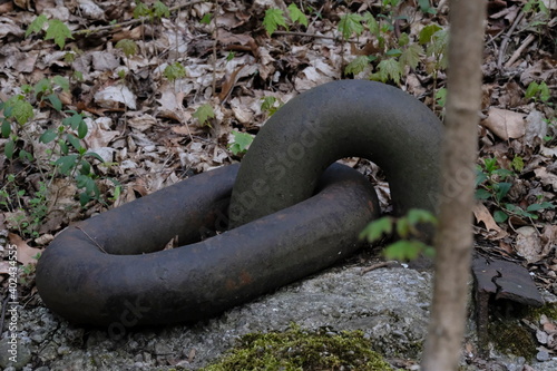 Heavy old anchor for ships on the riverbanks