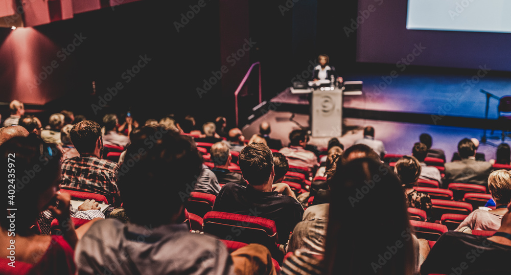 custom made wallpaper toronto digitalSpeaker giving a talk in conference hall at business event. Audience at the conference hall. Business and Entrepreneurship concept. Focus on unrecognizable people in audience.